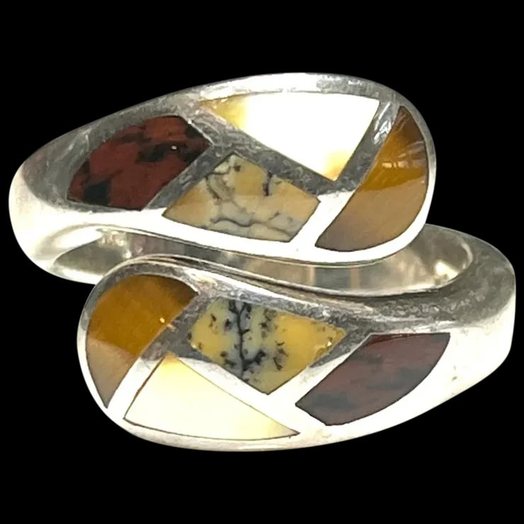 Estate Whitney Kelly Sterling Silver Bypass Inlay Ring: Title: Estate Whitney Kelly Sterling Silver Bypass Inlay Ring Description: Estate Whitney Kelly Sterling Silver Bypass Inlay RingHallmarked: WK 925 ChinaWeighs: 9.4 gramsMeasures US Ring SIze: 8.5 