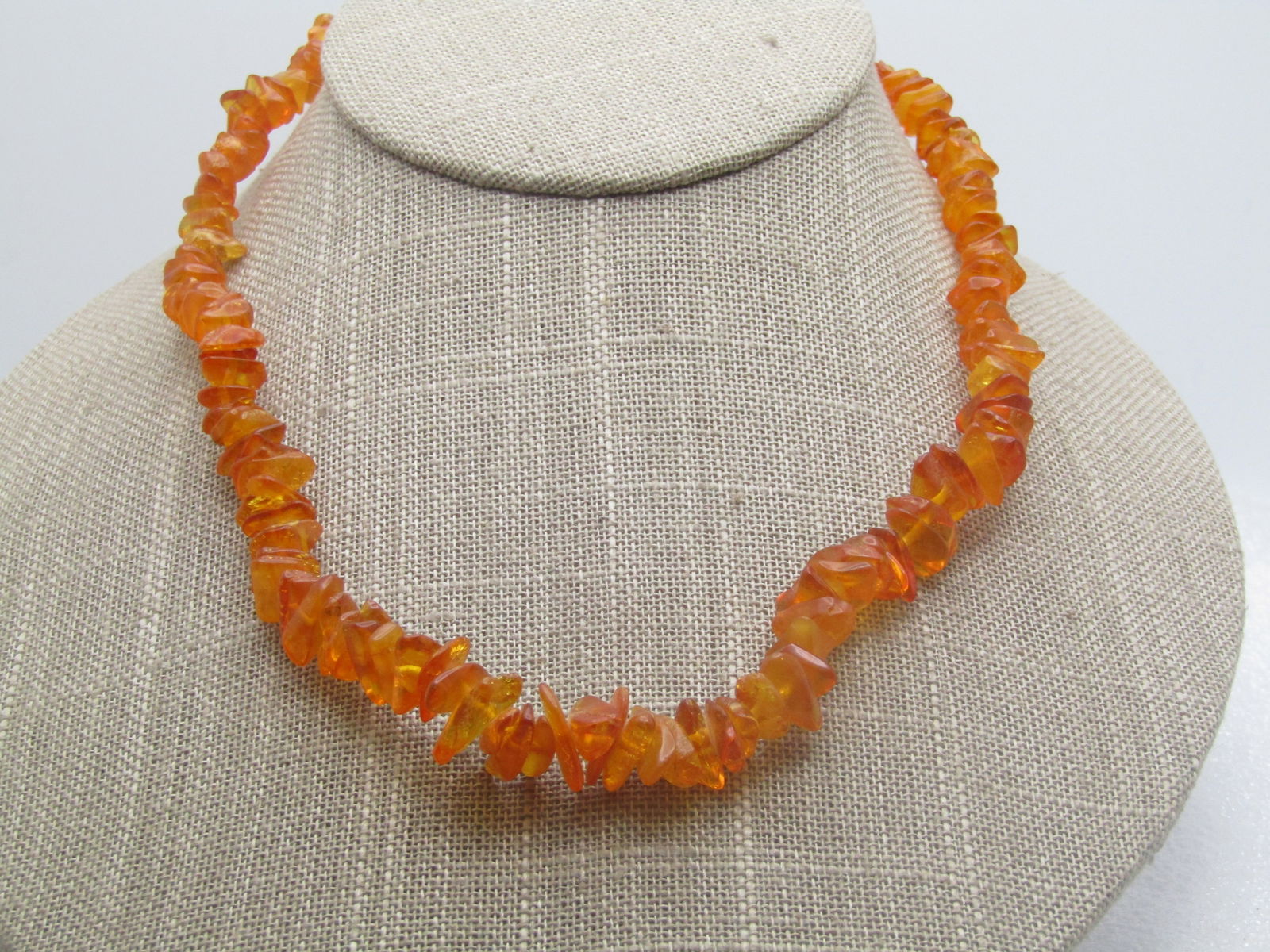 Vintage Honey Colored Baltic Amber Nugget Necklace, 16.5": Vintage Honey Colored Baltic Amber Nugget Necklace, 16.5", Nuggets that range from appx. 6mm to 14mm nugget like pieces arranged mixed throughout the necklace with a yellow plastic barrel clasp. Age o
