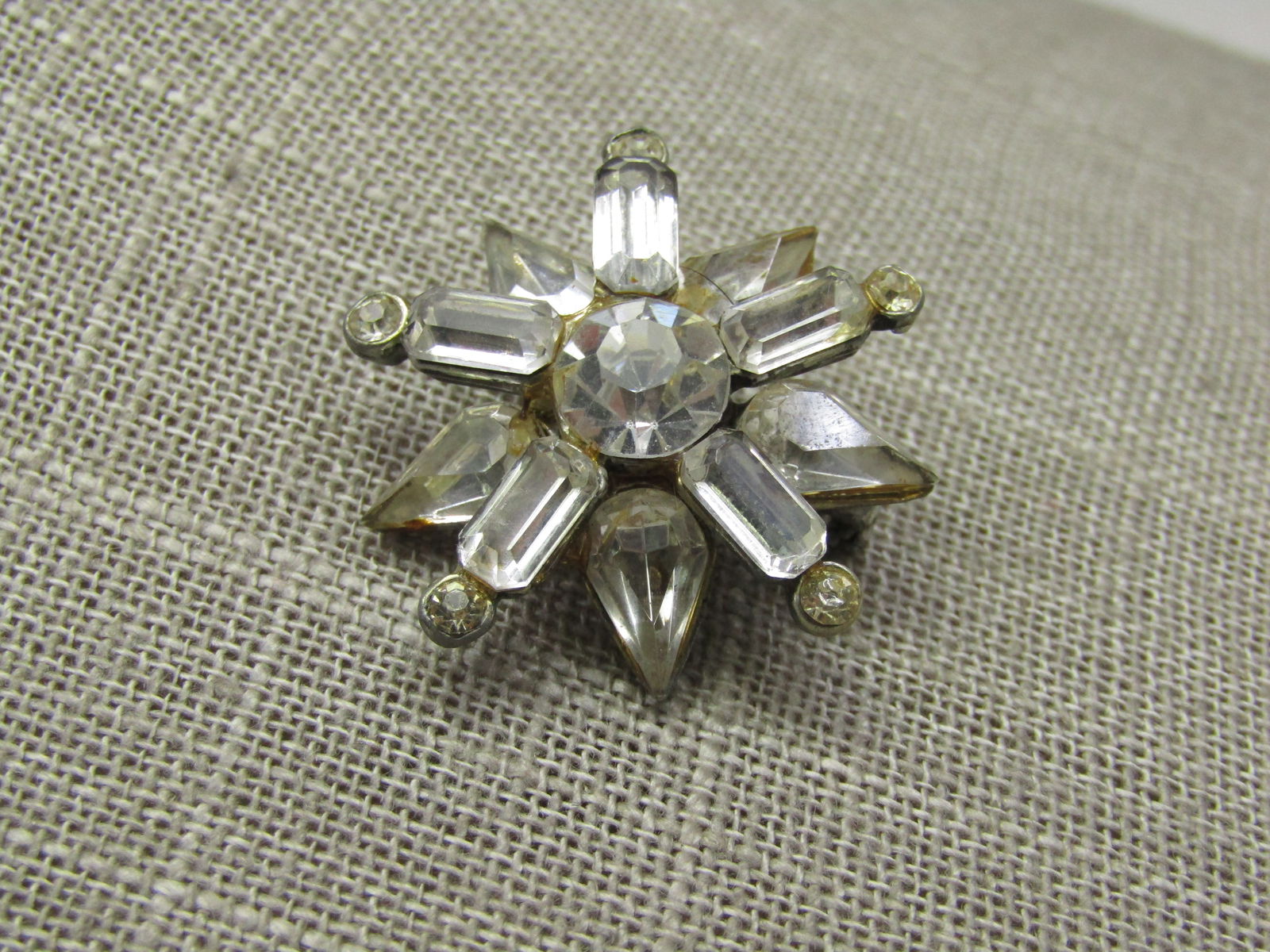 Vintage Sterling Rhinestone Art Deco Brooch, Signed HSB: Vintage Sterling Rhinestone Art Deco Brooch, Signed HSB, 1960's, apx. 9.06 grams. It has a half circle of clear baguettes on top with a mix of marquise and round stones on stem-like accents. There are