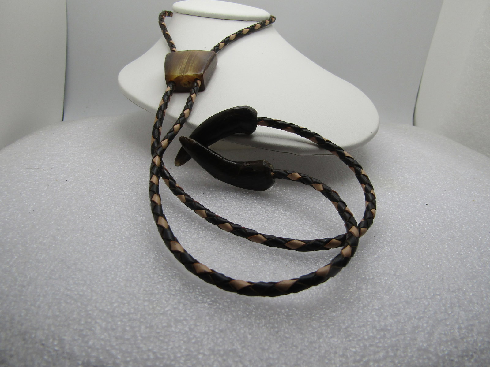 Vintage Polished Horn/Antler Bolo Tie with Horn End Caps, Mid-Century 38", Southwestern: Vintage Polished Horn/Antler Bolo Tie with Horn End Caps, Mid-Century 38" The tie is a braided black and white leather sith antler/horn end caps that are curved and darker than the slide which is carv
