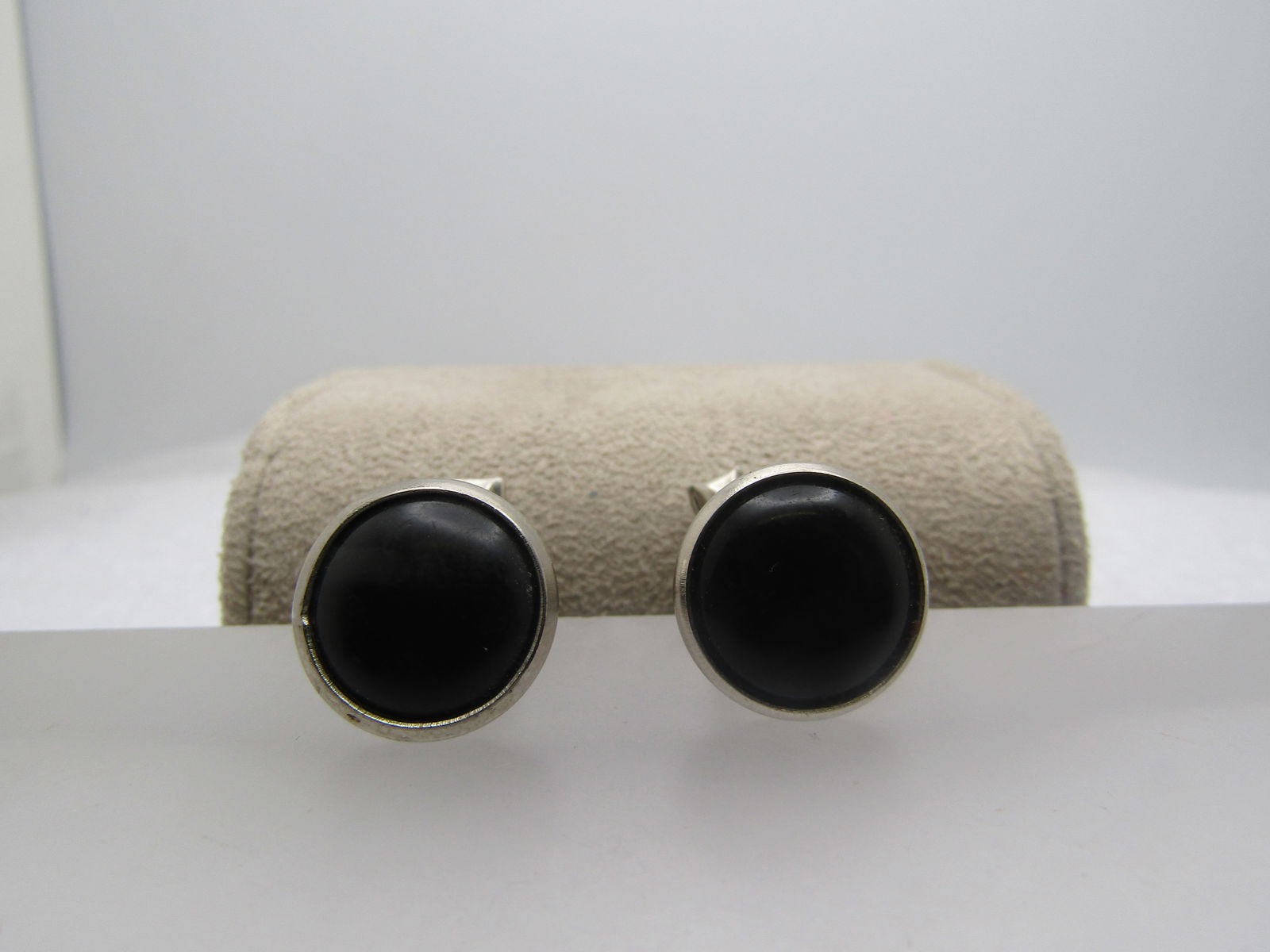 Vintage Black Glass Cufflinks, Bezel Set, 1960's: Vintage Black Glass Cufflinks, Bezel Set, 1960's. Silver tone with whale back mechanisms. They top has a black round appx. 11mm black stone that is set in a silver tone bezel. The top is slightly over