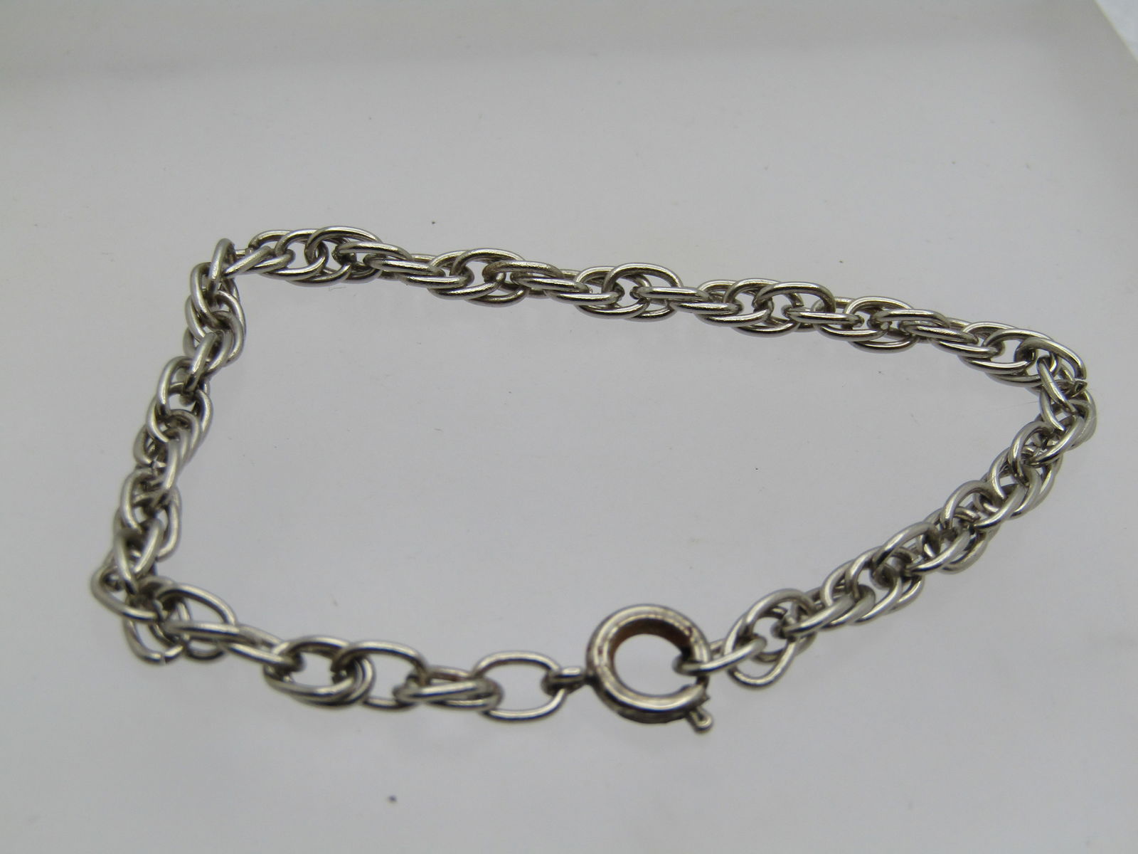 Vintage Silver Tone Twisted Chain Bracelet, 6.5" , 4mm: Vintage Silver Tone Twisted Chain Bracelet, 6.5" , 4mm. Simple chain that is very clean with spring clasp. Age is appx. 1970's-1980's. It is not signed by the maker. Great to wear as is or add a charm