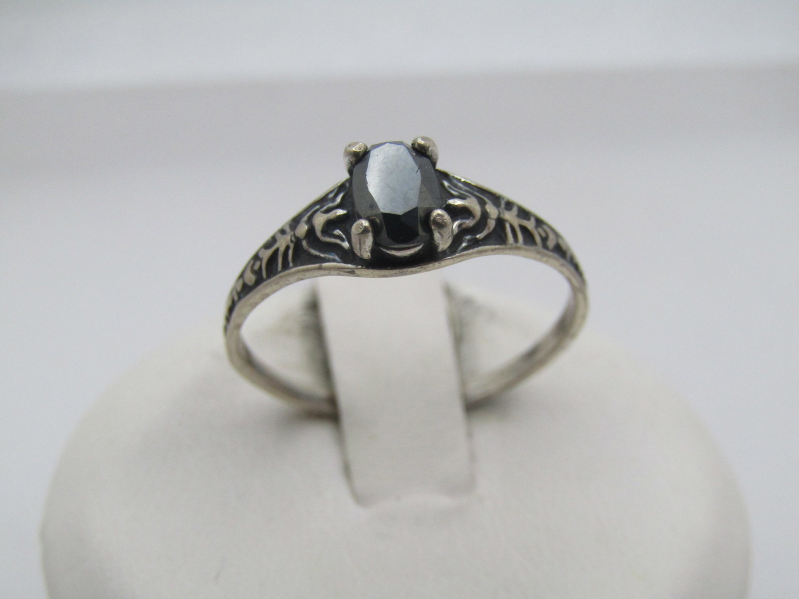 Vintage Sterling Hematite Ring. Sz. 7.75, Decorative Band, 1960's-1970's: Vintage Sterling Hematite Ring. Sz. 7.75, Decorative Band, 1960's-1970's. The hematite is appx. 6mm by 4mm and help with four prongs, The ring is 6mm at the center and tapers to 1.5mm at the back