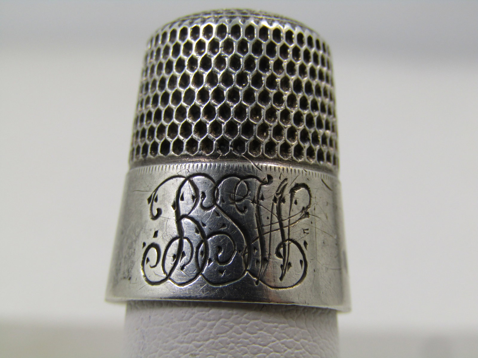 Vintage Sterling Thimble, Sz. 11, 1920's-1940's, Engraved, Signed S: Vintage Sterling Thimble, Sz. 11, 1920's-1940's, Signed S. It is engraved with scrip initials BSW on the wide band at the bottom of the thimble. The thimble is appx. 7/8" tall. This has the S script m