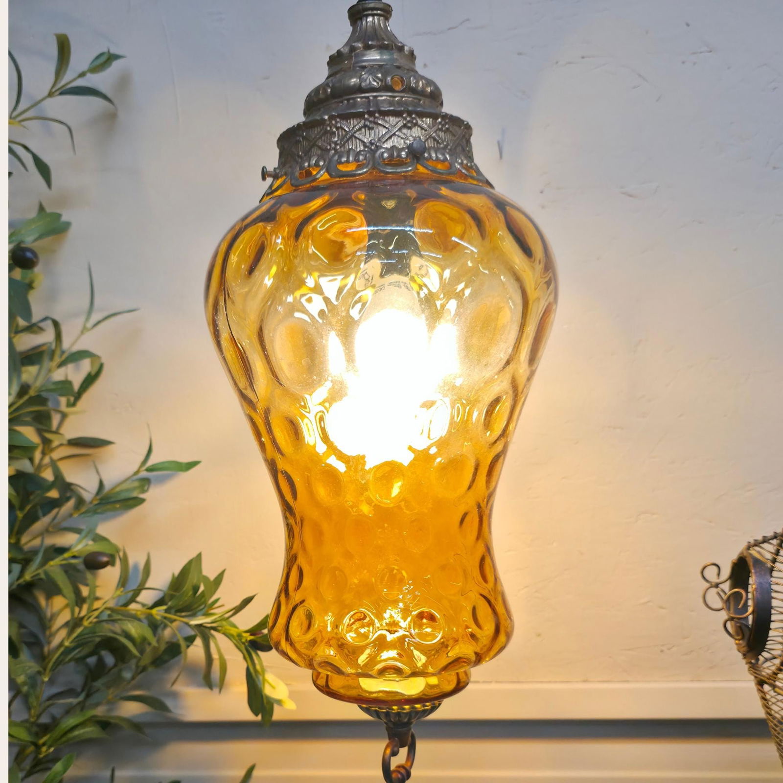 Vintage Gold Swag Lamp Plug in Wall Pendant Light Bubble Optic Hanging with Brass Crown Cap: Title: Vintage Gold Swag Lamp Plug in Wall Pendant Light Bubble Optic Hanging with Brass Crown Cap Description: Moody vintage amber glass swag pendant with bubble optic texture and brass crown cap 
