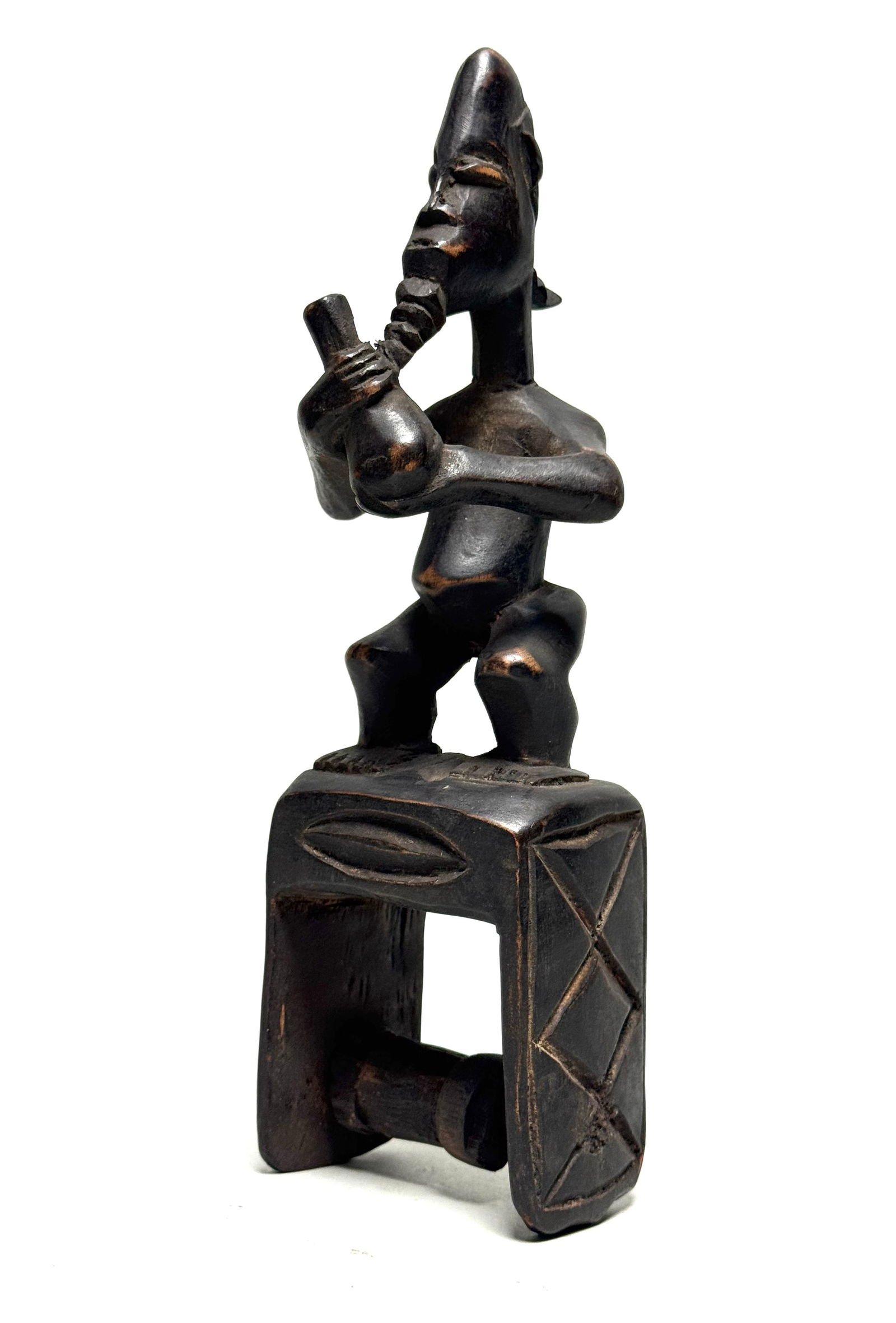 Pulley - Wood - Baule - Ivory Coast: Title: Pulley - Wood - Baule - Ivory Coast Description: A Baule heddle pulley with head and ornaments. In the art of the Baule, decorations have a meaning and can be found on everyday objects such as