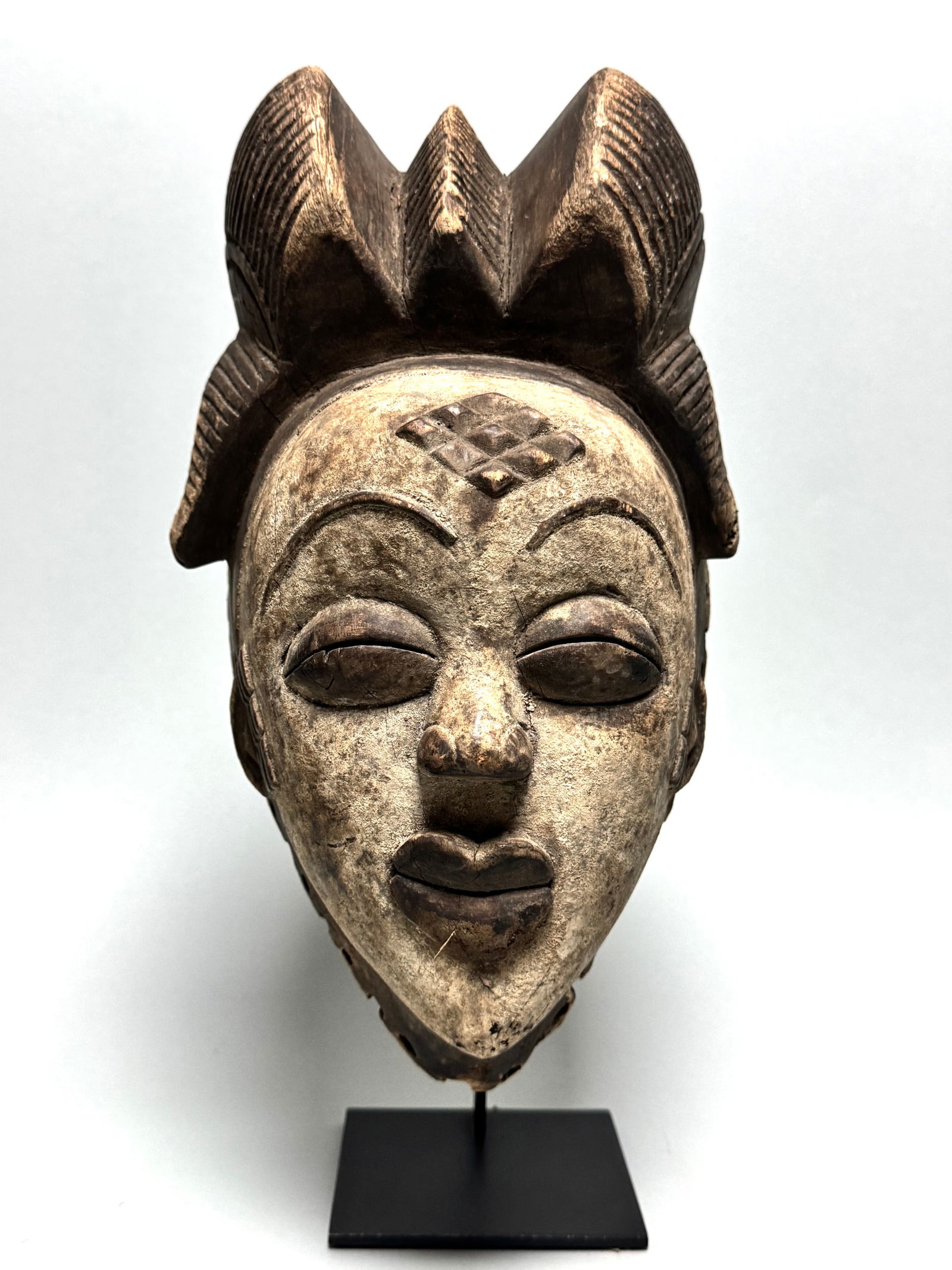 Old Punu ceremonial / funeral mask, Gabon - Africa: Title: Old Punu ceremonial / funeral mask, Gabon - Africa Description: Punu funeral mask. This funeral mask and thereafter used as entertainment mask worn by professional dancers stiltwalkers. Punu ma