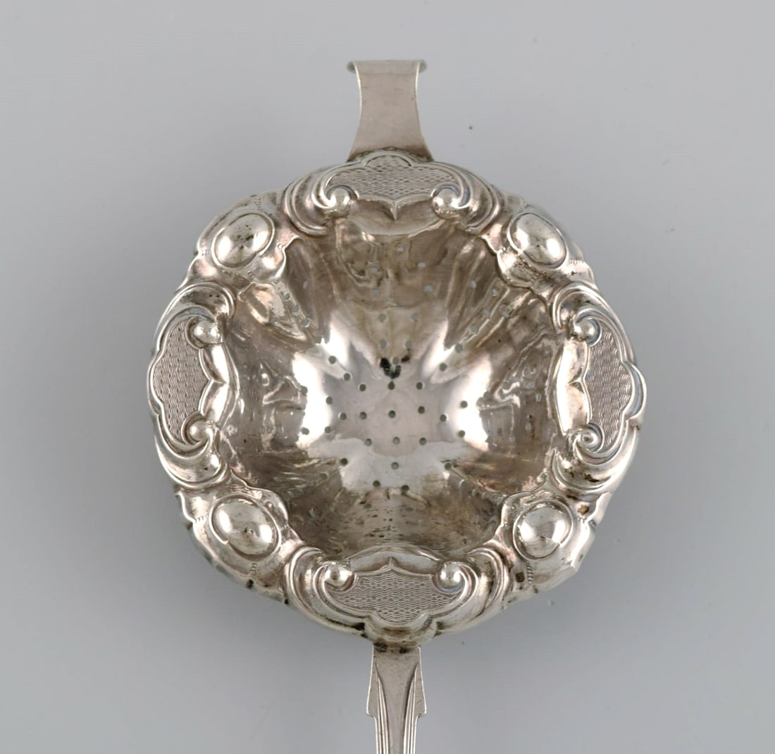 European silversmith. Antique silver tea strainer. Dated 1855 - 2