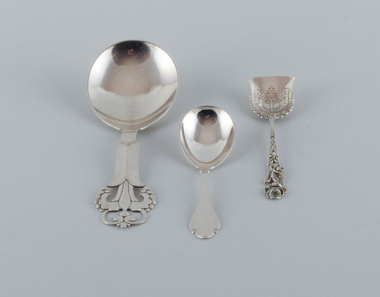A collection of three silver spoons.: Title:A collection of three silver spoons.Description:A collection of three silver spoons. Two Danish 830/1000 spoons from the 30s/40s. One German spoon stamped 800. In good condition with minor