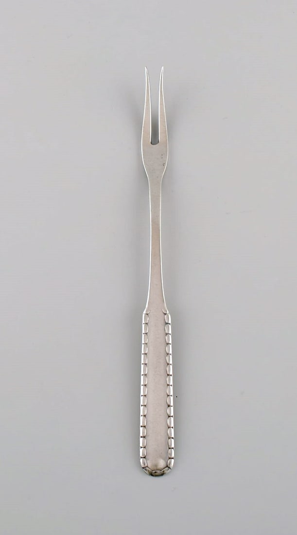 Early Georg Jensen Rope cold meat fork in silver (830). Dated 1915-1930. (1 of 4)