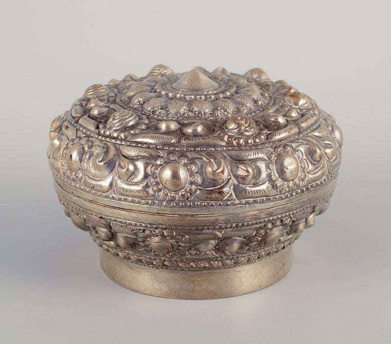 Chinese silversmith. Lidded jar richly decorated in relief with flowers and ornaments. (1 of 6)