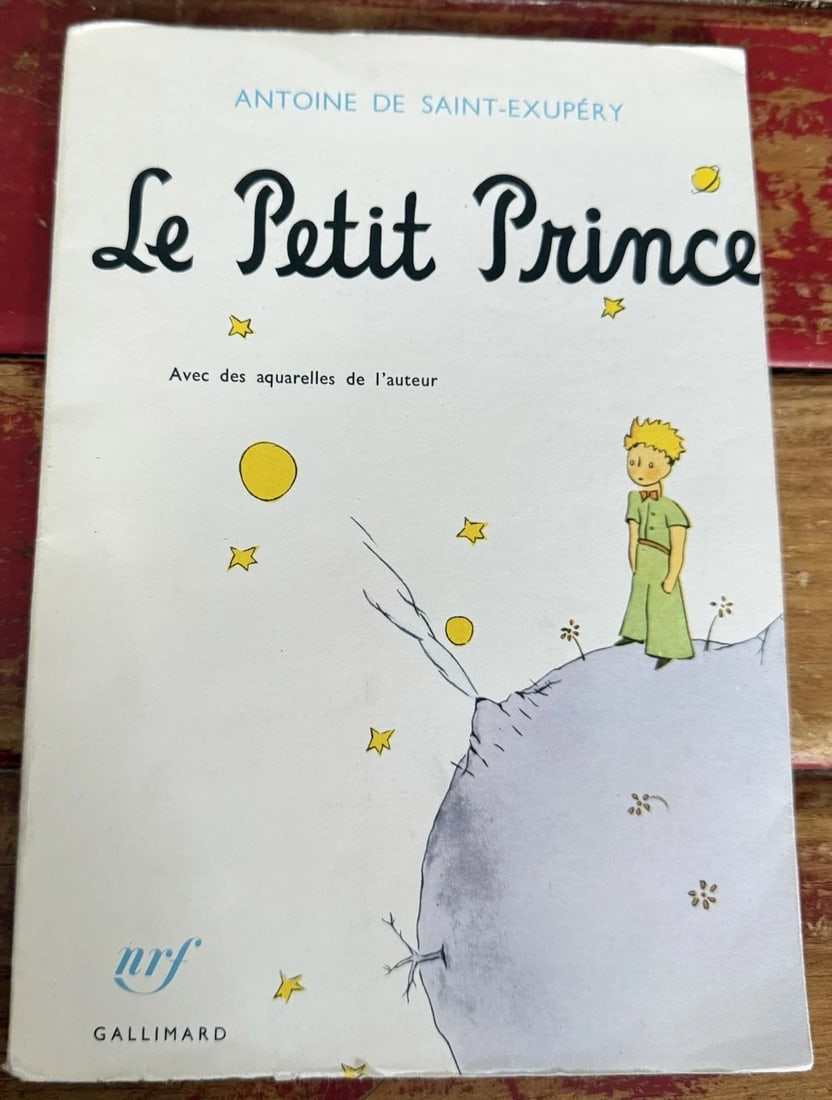 Antoine De Saint-Exupery LE PETIT PRINCE 1st Edition Thus 2nd Printing: The product is a softcover 1st Edition Thus of Antoine De Saint-Exupery's "Le Petit Prince" published by Gallimard in France in 1982. This original edition features illustrations by the author