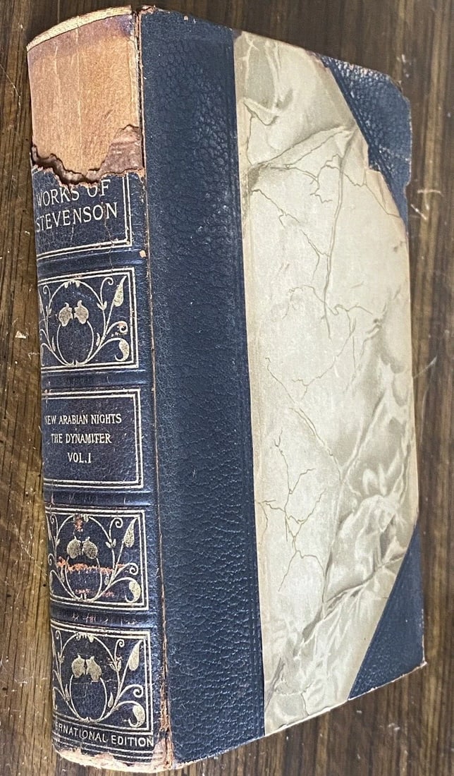 Robert L. Stevenson DeLuxe Ltd.Ed.New Arabian Nights,Dynamiter, 1906 CTBrainard: Robert Louis Stevenson DeLuxe Ltd.Ed. Of 1,000 Copies. New Arabian Nights, The Dynamiter, C.T.Brainard 1906. Half leather with tan marbled boards, portion of spine missing. Leather spine with gilt tit