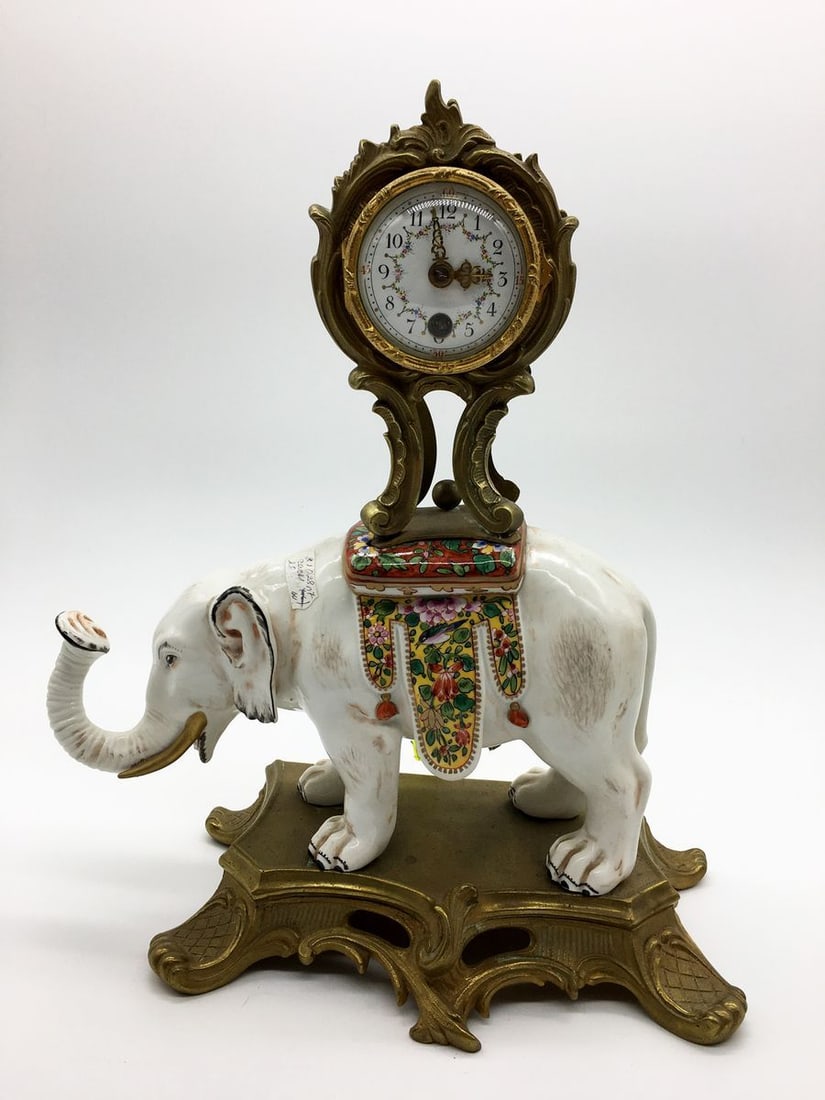 Stone clock with a sculptural image of an elephant: Title: Stone clock with a sculptural image of an elephant Description: Verndec 2 ITEM DESCRIPTION : *Medium : bronze, casting, gilding, porcelain *The size: 32x27 cm/12.59x10.62" inches *Year: Western