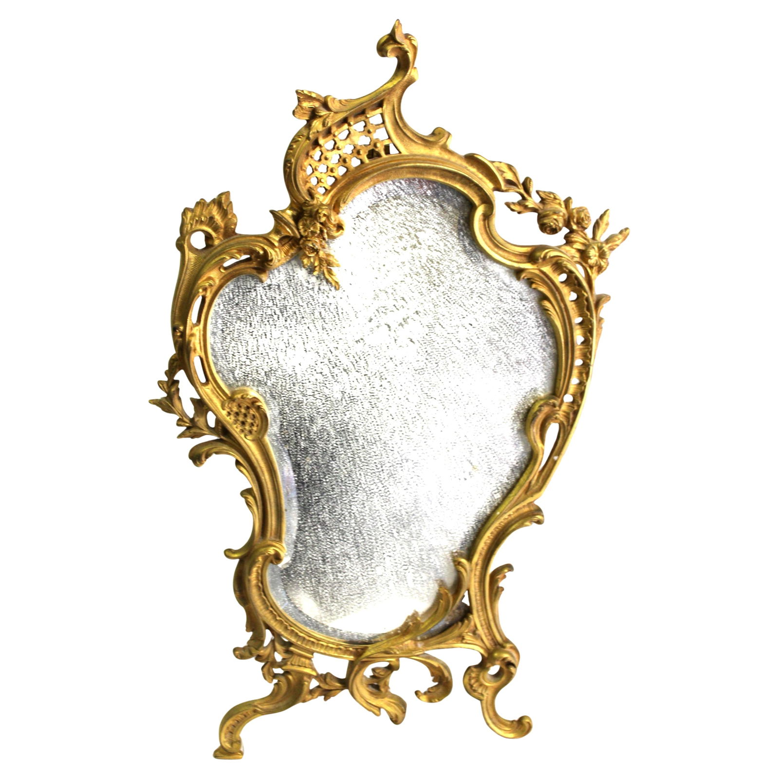 Vintage French, Gold Dore' table mirror. Early 20 Th Century: A larger size Table Mirror in very fine metal work and with a hi-light polished Gold Dire' plated finish . No factory marks except on the back of the support leg . Looks like an ( IB ) see the details