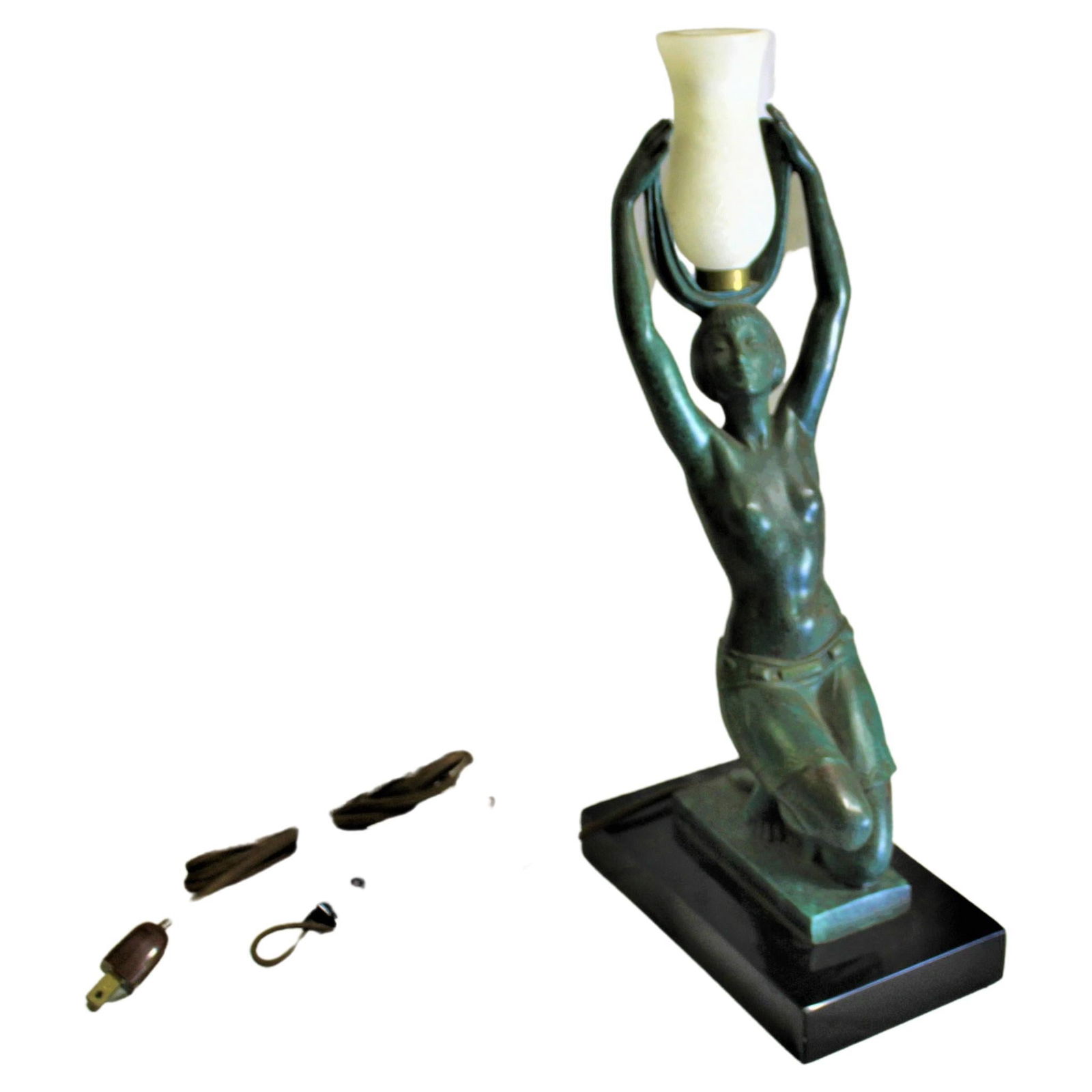 Art Deco Nude Lady Lamp: Deco girl lamp cast in Bronze with a green patina. After one of the famous Art Deco Artist . Mounted on an absolute black marble base 8 1/4" by 4 1/2" by 1" thick solid. Has a Alabaster shade. Has