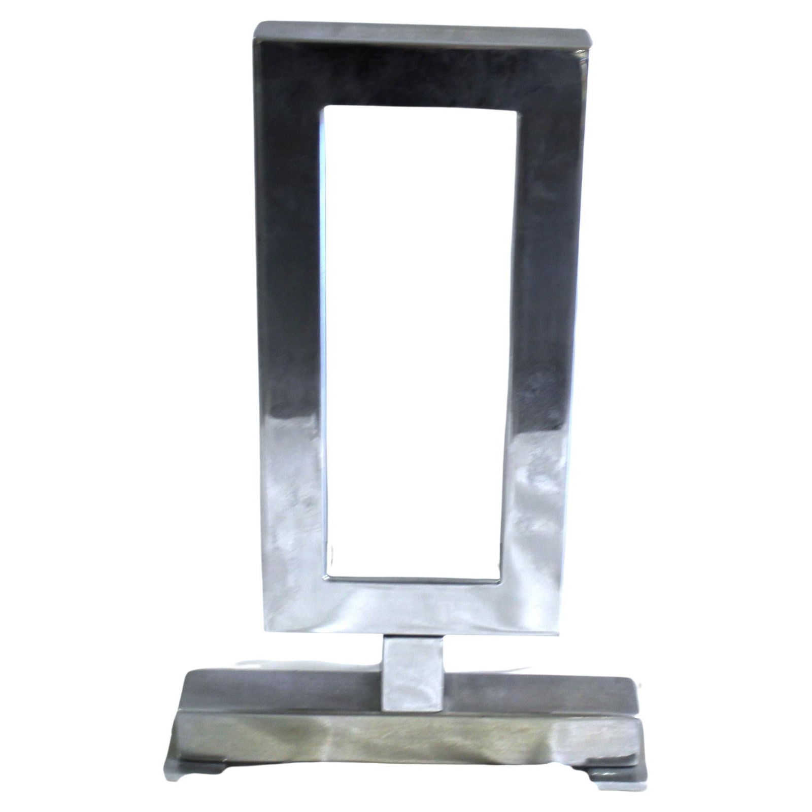 Art Deco Andiron Single: Custom designed and made for an Interior designer in LA. This is the showroom sample never used. Measures: At 17 3/4" height and 11" wide. Could be used for anything. Hi-polished Nickel finish. Has