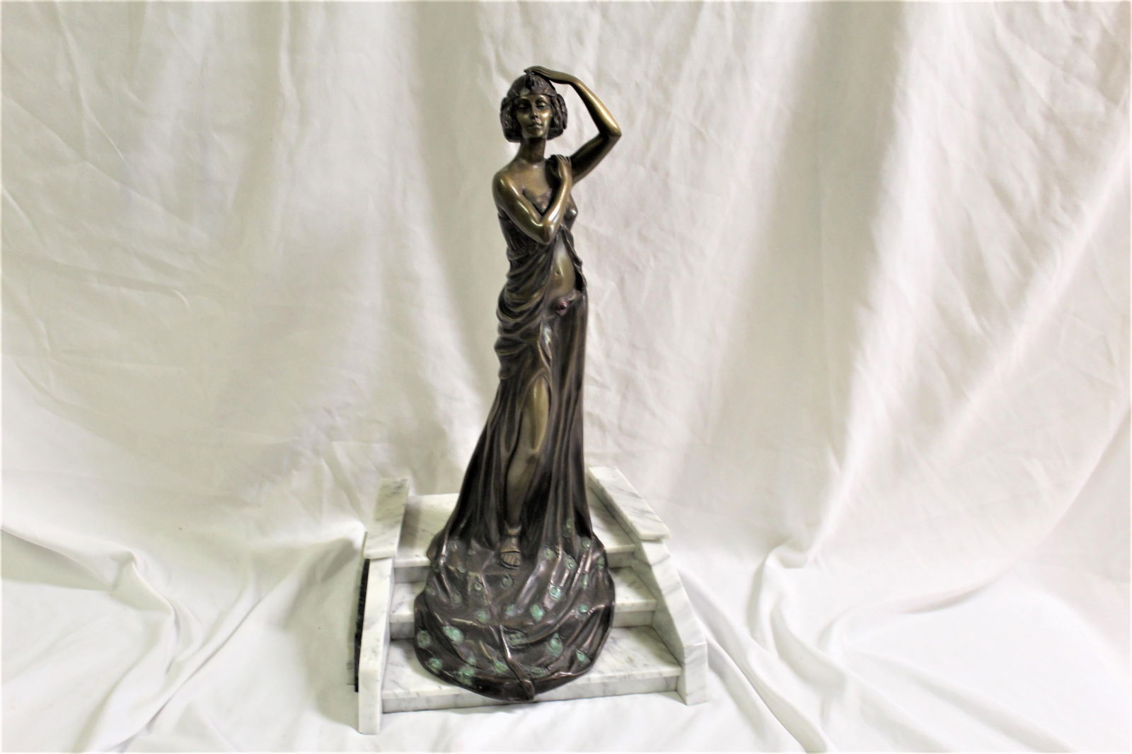Mid Century/Modern Deco Sculpture, Bronze: An elegant Lady walking down the steps cast in bronze with multi-patinas. Mounted on a solid marble grand staircase. Title is ( The Grand Entrance ) in the manner of M.Reviere. One of the most popular