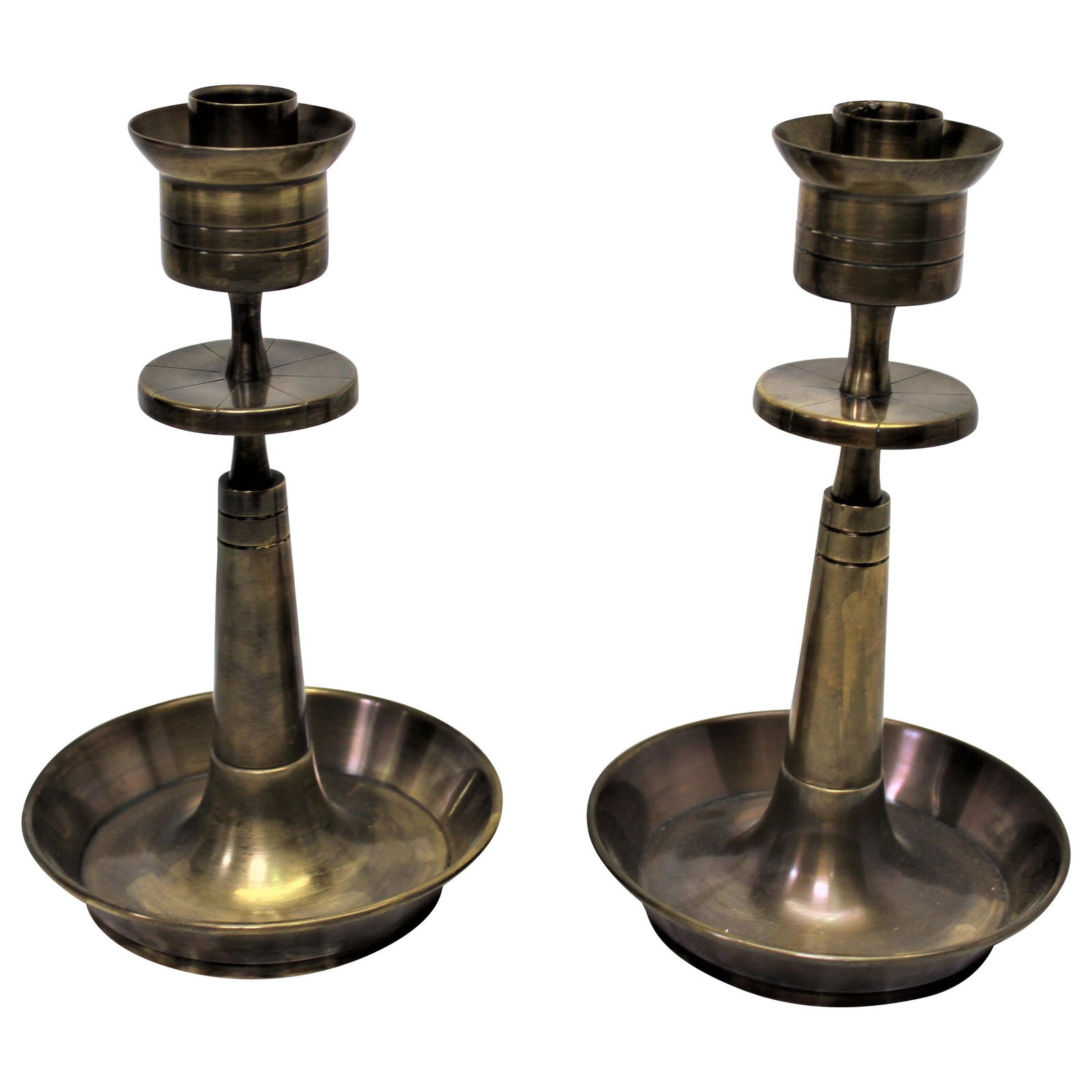 Candlesticks All Brass After Tommy Parzinger Antique Brass Finish: Modern design candlesticks in solid brass with an antique finish. After Parzinger. Reserve: $225.00 Shipping: Domestic: Flat-rate of $95.00 to anywhere within the contiguous U.S. International: Foreig
