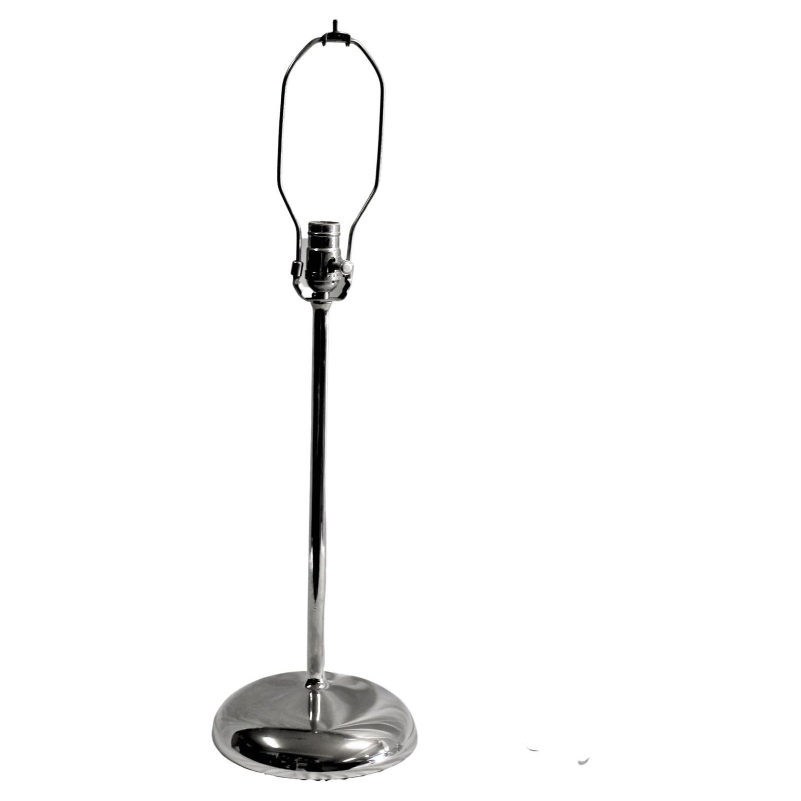 Art Deco /Modern Table lamp Hi-polished Nickel: This modern lamp has a round spun smooth shaped base joined with a slender riser up to the socket mount . All put together and hi-polished metal . Then Hi-polished Nickel plating applier . It has a