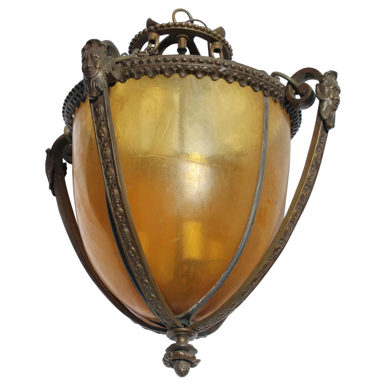 Lantern, Bronze, Mans Face, Amber Glass: English design Lantern in re-cast bronze with good patina. Amber color Lead glass shade. It has a 4 light ( Candelabra ) cluster body. About 16" across and 24 " total ht. Little mans faces cast on
