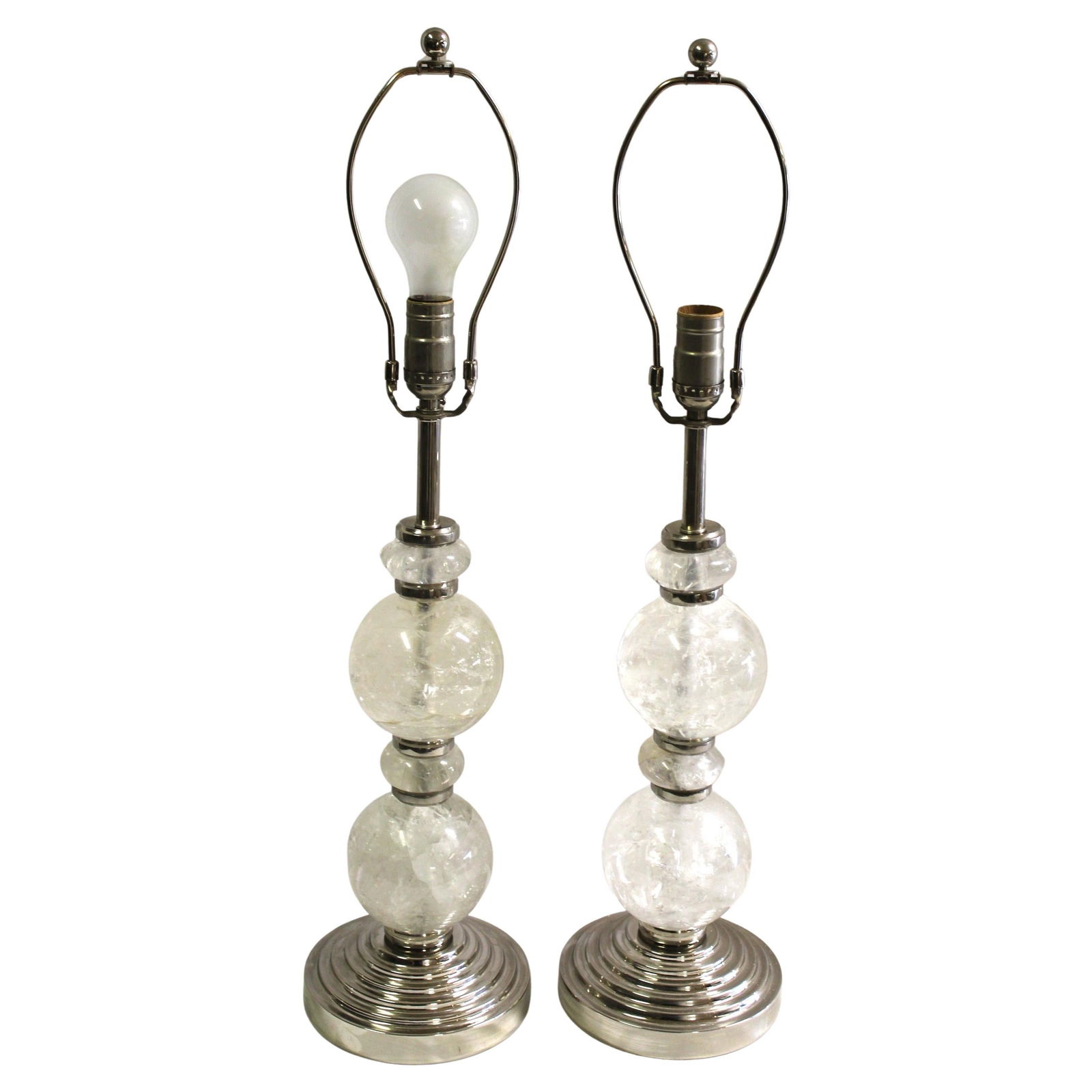 Mid Century/Modern/ Art Deco Rock Crystal Ball lamps pair Nickel: Custom designed by a well known Designer in Los Angeles . Custom mad for the Lighting showroom . Rock Crystal spheres and spacers were made in Brazil . The metal spacers were designed to hold the Rock