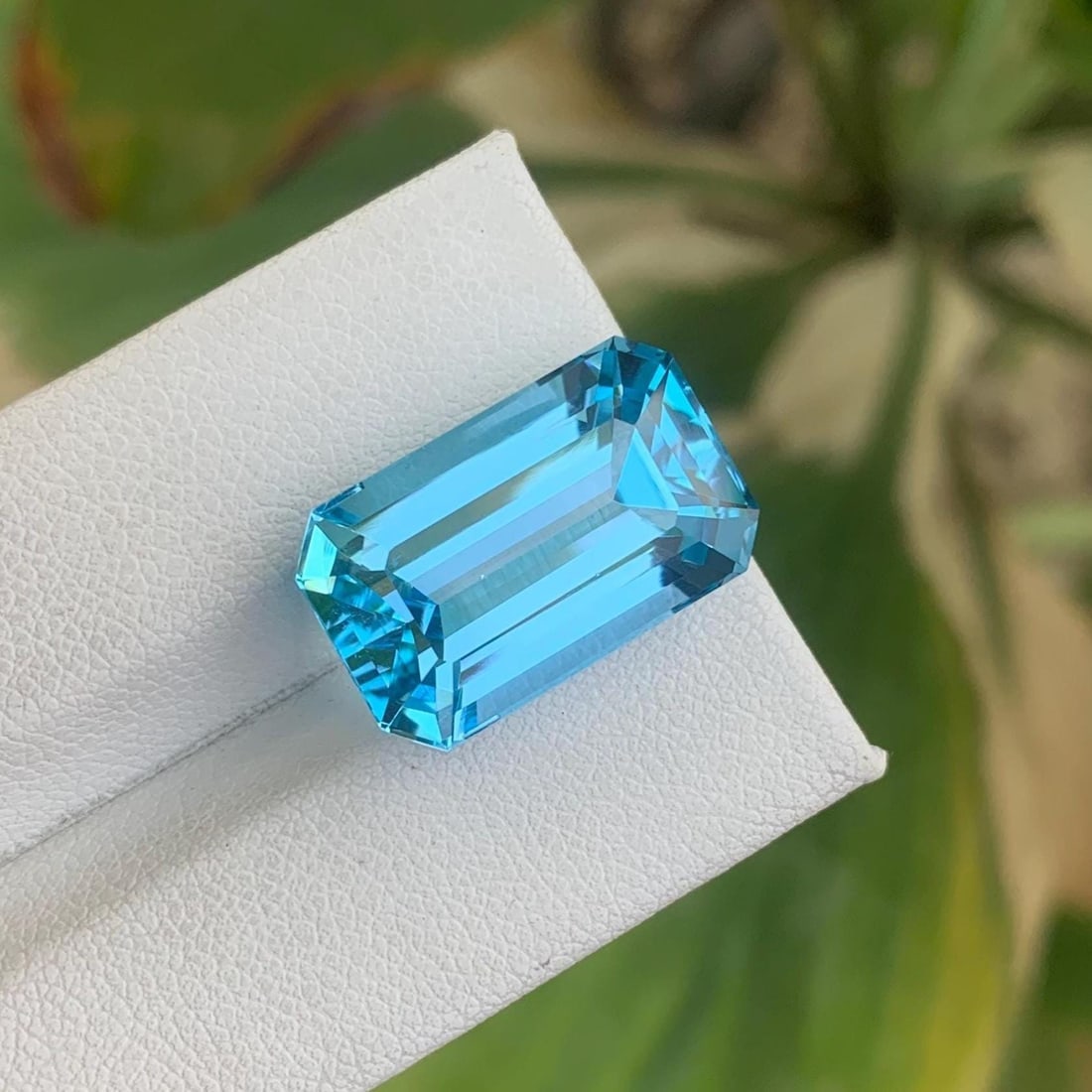 Emerald Cut Swiss Blue Topaz Gemstone: 21.30 Carat December Birthstone: Title: Emerald Cut Swiss Blue Topaz Gemstone: 21.30 Carat December Birthstone Description: Gemstone: Topaz Carat weight: 21.30 Add a splash of vibrant elegance to your Jewelry collection with this