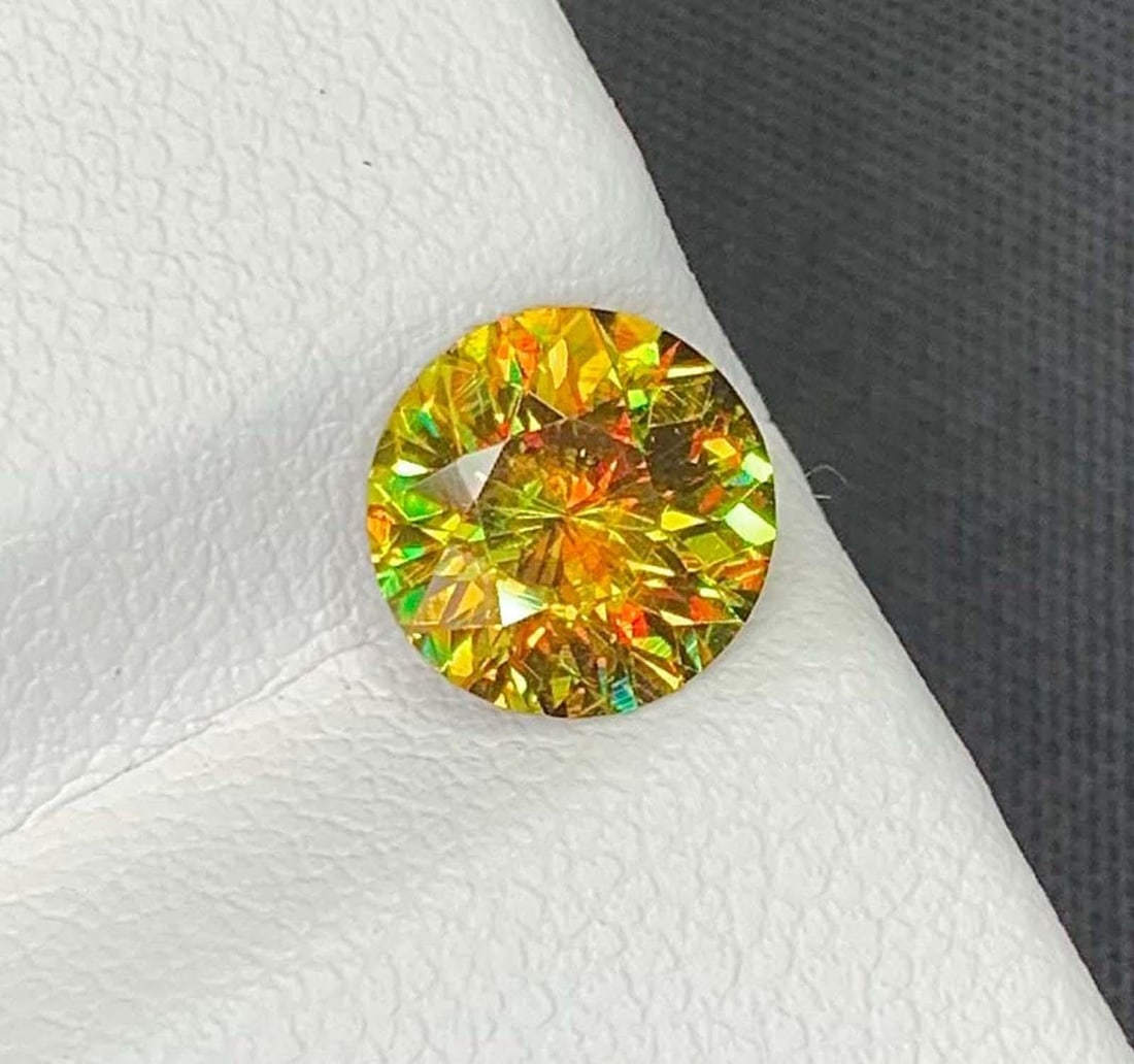 AIG Certified Lustrous Sphene Gemstone: MultiColor Round Cut, 1.63 Carat: Title: AIG Certified Lustrous Sphene Gemstone: MultiColor Round Cut, 1.63 Carat Description: Gemstone: Sphene AIG Certified Lustrous Sphene Gemstone: MultiColor Round Cut Weight : 1.63 cts