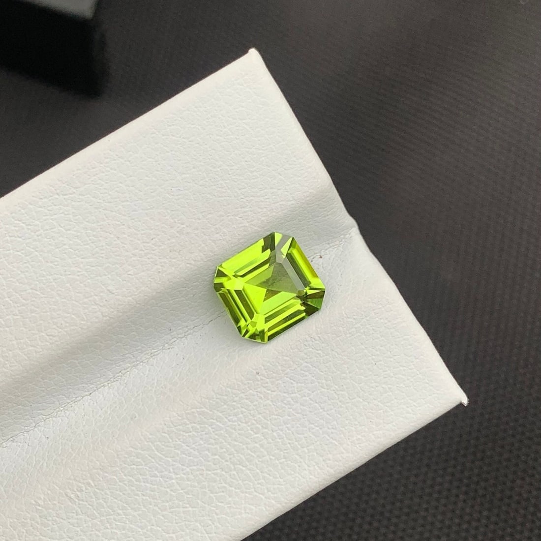 Apple Green Peridot Gemstone: 2.15 Carat Asscher Cut, Eye Clean: Title: Apple Green Peridot Gemstone: 2.15 Carat Asscher Cut, Eye Clean Description: Item details Highlights Handpicked by GemsAndJewelsUSA Supplies for making crafts Gemstone: Peridot Carat