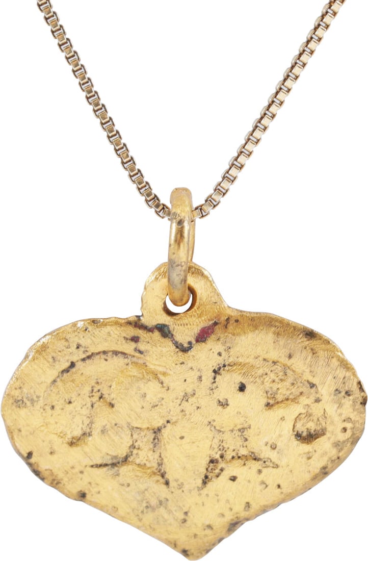 VIKING HEART PENDANT NECKLACE, C.950-1050 AD: Over 7/8" width (0.92”), The Viking heart in its fully developed form with a full cusp top formed by the scroll terminals of the broad borders which extend into the field forming a trefoil of