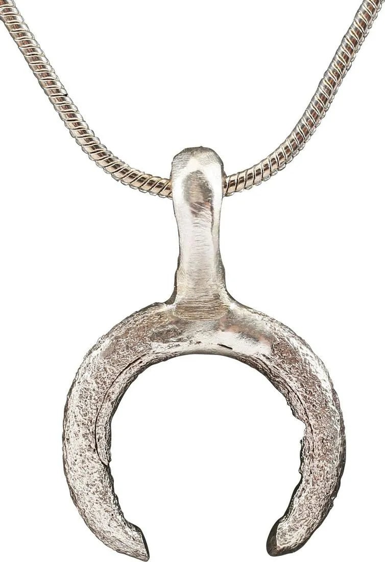 VIKING LUNAR PENDANT NECKLACE C.900-1000 AD: Just under 1" (0.92") total height. Fine crescent form. As expert navigators, the constellations signified mystery and power to Vikings. The Moon was personified as Mani, brother to Sol the Sun, and