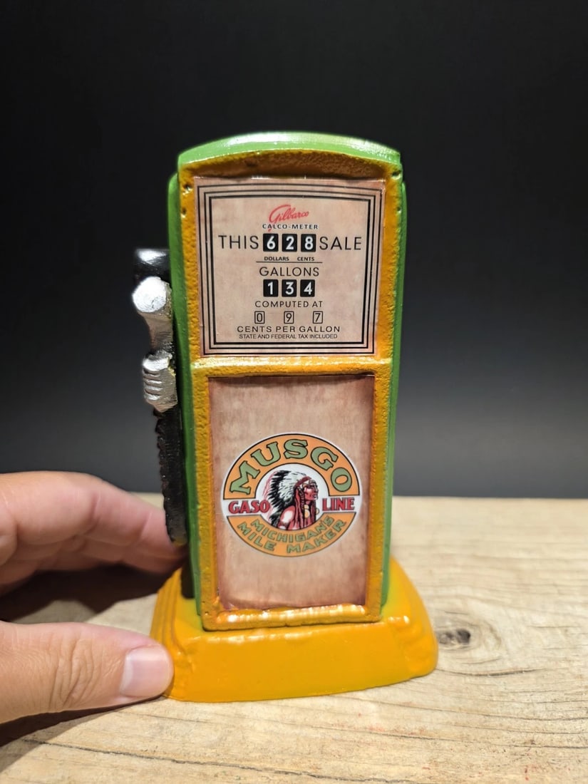 7" Musgo Gas Pump Coin Bank: Miniature reproduction collectible gas pump, specifically an "Musgo Gas". It features a classic design, reminiscent of vintage gas pumps Reserve: $20.00 Shipping:Domestic: Flat-rate of