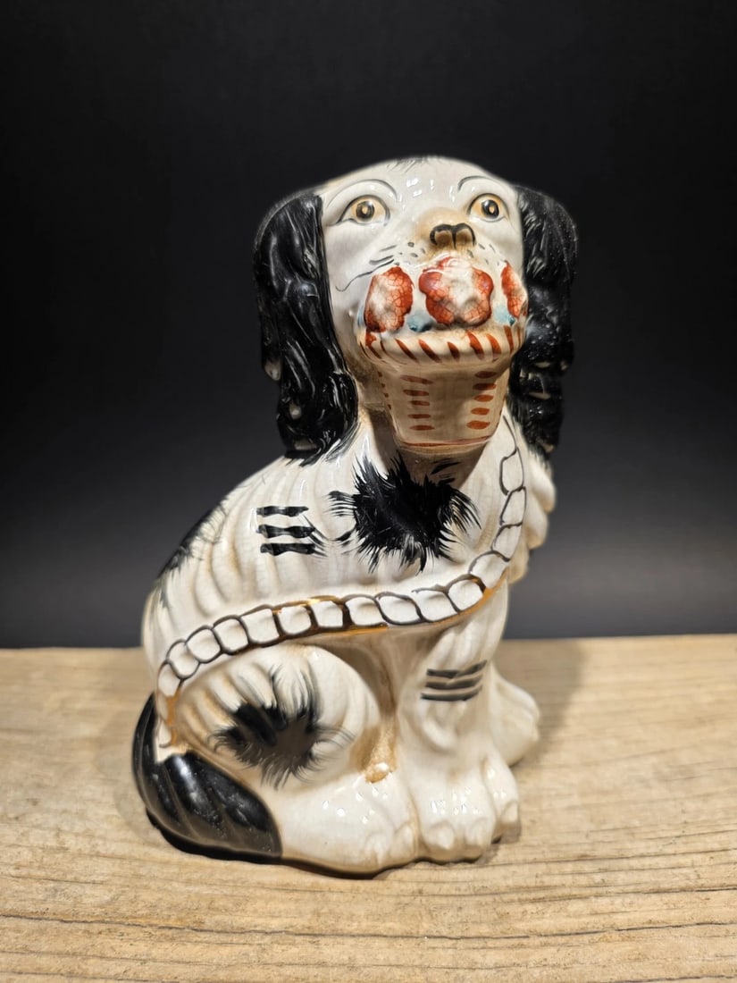 8" Staffordshire Spaniel Dog Figurine: 8" Tall Roughly 1 pound Wonderful Reproduction Staffordshire Spaniel figurine Popular in England from the 18th century onward. These figurines, often produced in Staffordshire, are commonly modeled af