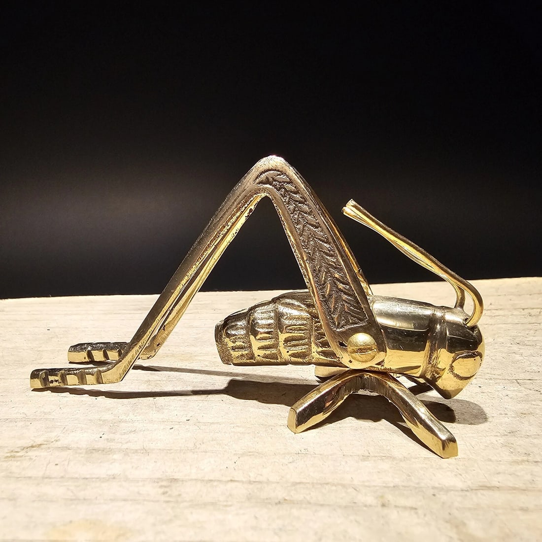 Good Luck Solid Brass Fireplace Hearth Cricket: 3 1/2" Long 1 1/8" Wide 2" Hide Wonderful antique style brass hearth cricket. Many times found on the hearth crickets are said to bring good luck and fortune to ones house and home. Nice detail and
