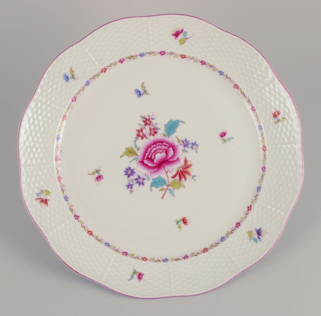 Herend, large round porcelain dish with floral motif. Dated 1944: Title: Herend, large round porcelain dish with floral motif. Dated 1944 Description: Herend, large round porcelain dish. Hand-painted with polychrome floral motifs. Pink rim. Marked and dated 1944. Pe