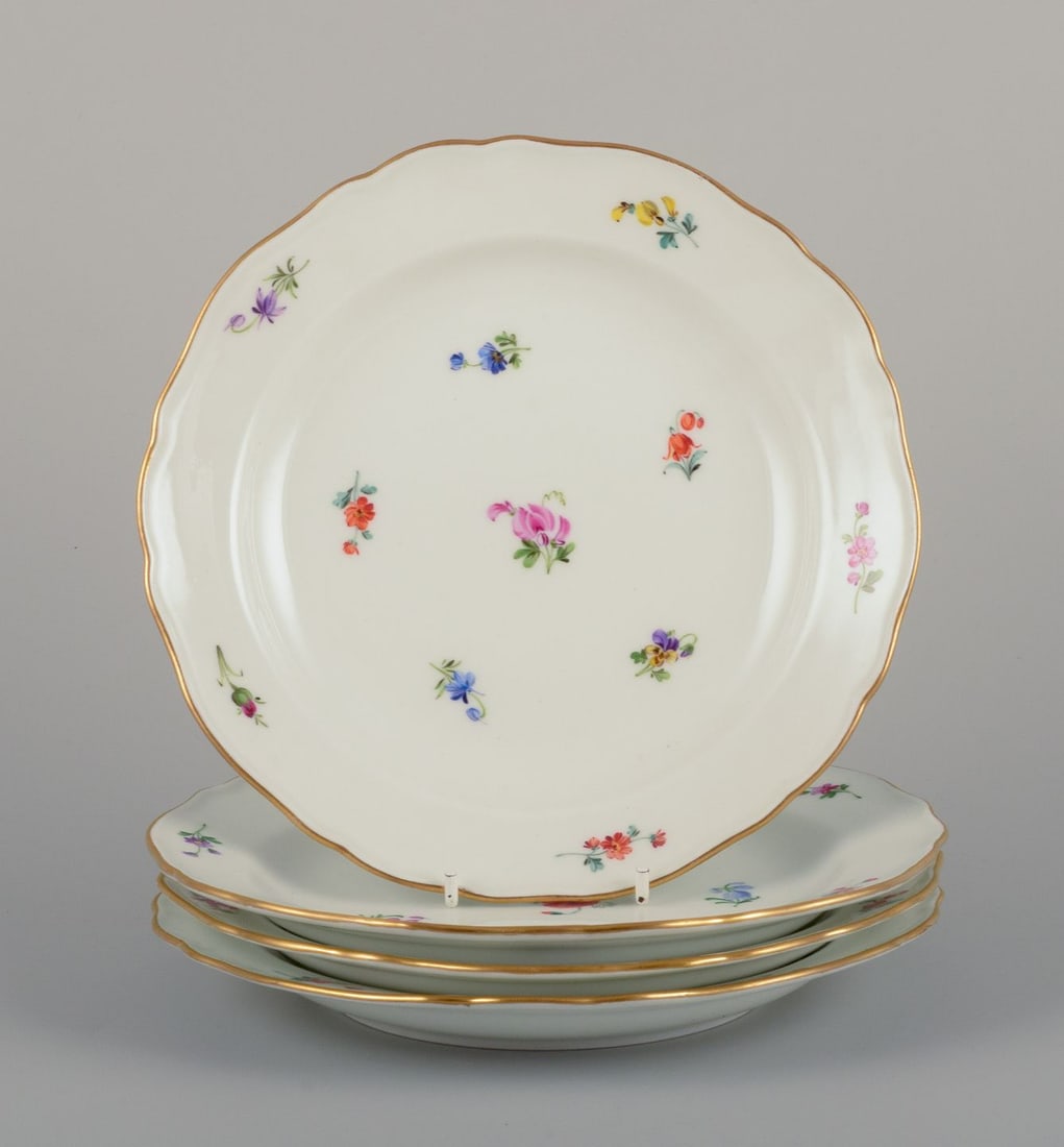Meissen, Germany. Four porcelain plates with floral motifs, gold rim. Approx. 1920s/1930s.: Title: Meissen, Germany. Four porcelain plates with floral motifs, gold rim. Approx. 1920s/1930s. Description: Meissen, Germany. Four porcelain plates. Hand-painted with polychrome floral motifs,