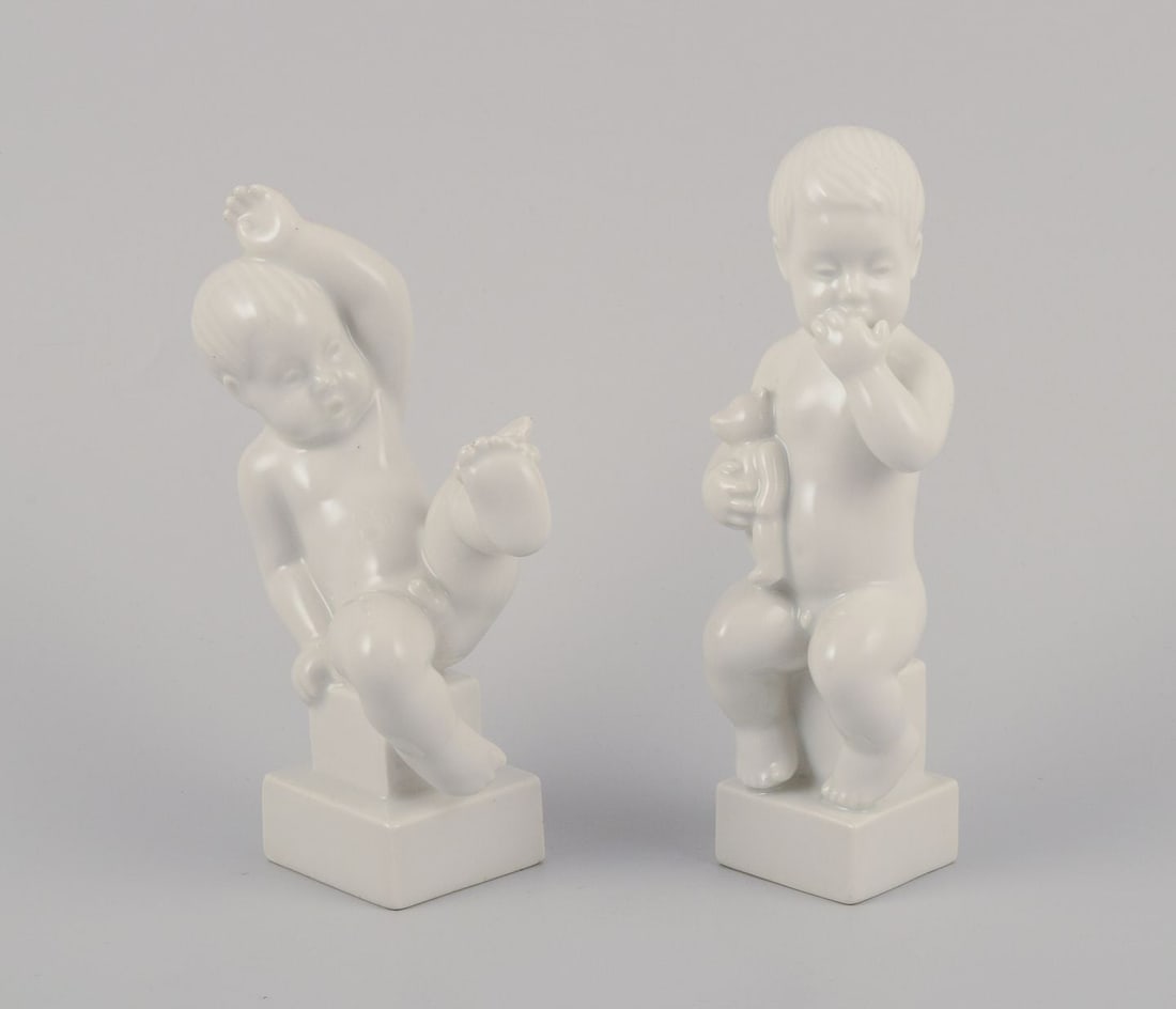 Bing & Grondahl. Two porcelain figurines of two little boys. White glazed. 1920s/30s.: Title: Bing & Grondahl. Two porcelain figurines of two little boys. White glazed. 1920s/30s. Description: Bing & Grondahl. Two porcelain figurines of two little boys. White glazed. 1920s/30s. Marked.