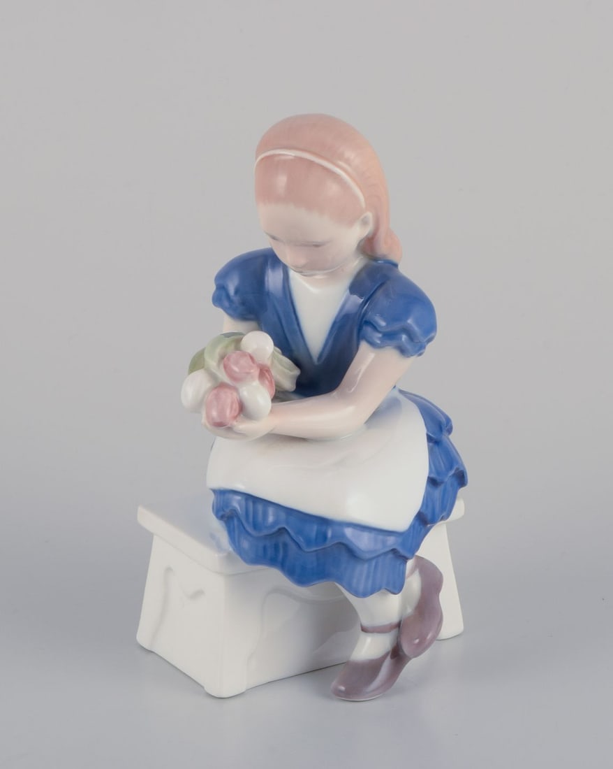 Bing & Grondahl, Denmark. Porcelain figurine of a seated girl with a bouquet of flowers, 1930s: Title: Bing & Grondahl, Denmark. Porcelain figurine of a seated girl with a bouquet of flowers, 1930s Description: Bing & Grondahl, Denmark. Porcelain figurine of a seated girl with a bouquet of flowe