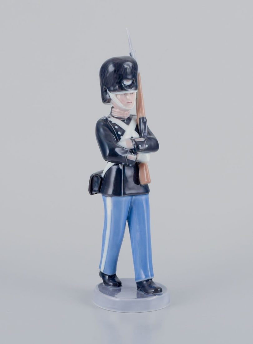 Royal Copenhagen porcelain figurine of a royal Danish guardsman. Dated 1964.: Title: Royal Copenhagen porcelain figurine of a royal Danish guardsman. Dated 1964. Description: Royal Copenhagen porcelain figurine of a royal Danish guardsman. Model 776. Dating: 1964 Marked. First
