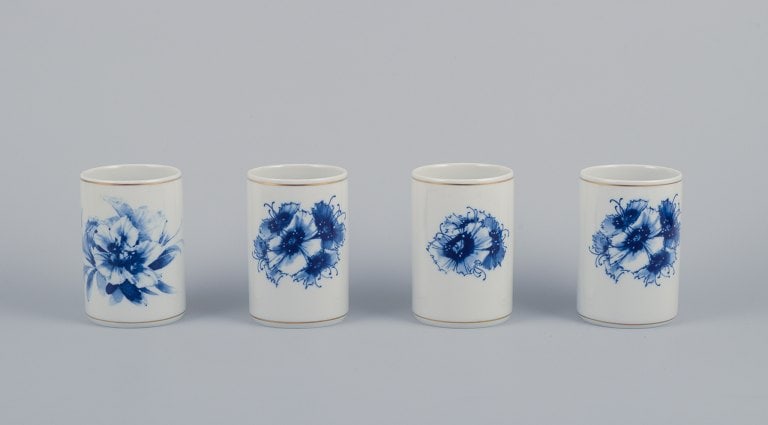 Meissen, Germany. Four vases. Hand-decorated with blue floral motifs, gold rim.: Title: Meissen, Germany. Four vases. Hand-decorated with blue floral motifs, gold rim. Description: Meissen, Germany. Four vases. Hand-decorated with blue floral motifs, gold rim. Mid-20th century.