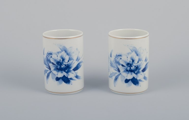 Meissen, Germany. Two vases. Hand-decorated with blue floral motifs, gold rim.: Title: Meissen, Germany. Two vases. Hand-decorated with blue floral motifs, gold rim. Description: Meissen, Germany. Two vases. Hand-decorated with blue floral motifs, gold rim. Mid-20th century.