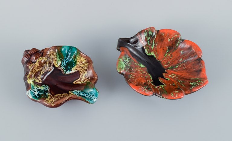 Vallauris, France, two leaf-shaped dishes in brightly colored glazes. (1 of 5)
