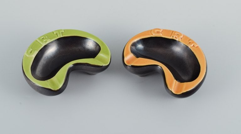 Vallauris, France, two ceramic bowls with yellow and green glazes on a black base. (1 of 7)