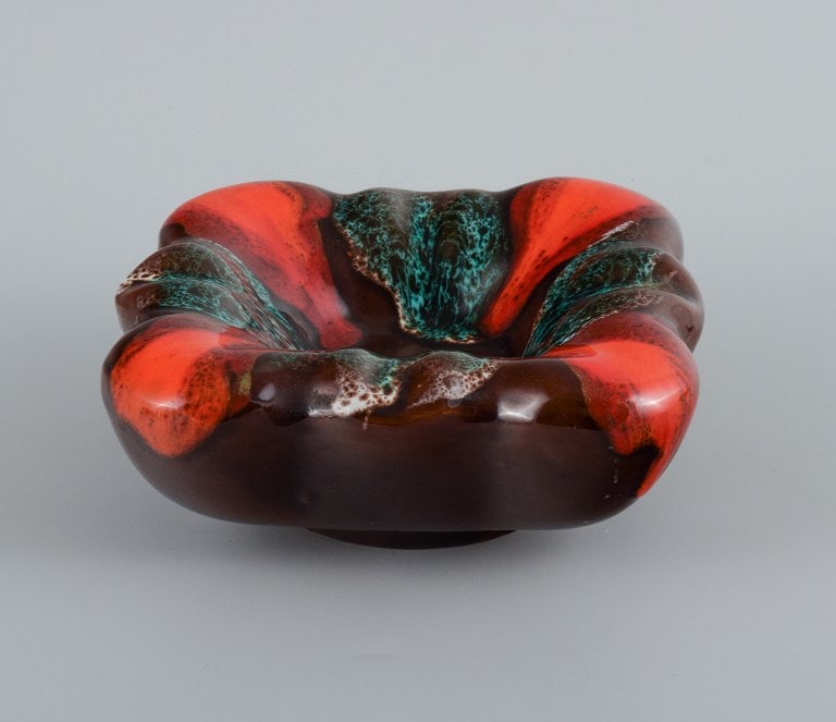 Vallauris, France, three ceramic bowls in brightly colored glazes in red and green on a dark base. - 5