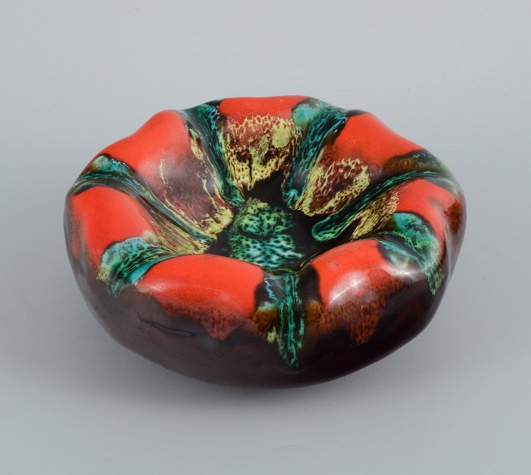 Vallauris, France, three ceramic bowls in brightly colored glazes in red and green on a dark base. - 6