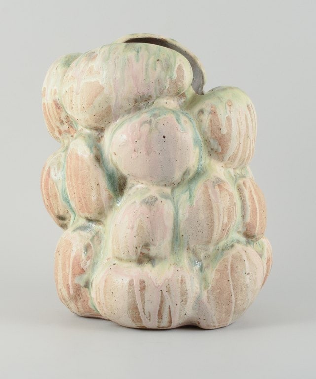 Christina Muff, Danish contemporary ceramicist (b. 1971). Monumental organically shaped vase. This: Title: Christina Muff, Danish contemporary ceramicist (b. 1971). Monumental organically shaped vase. This piece is covered in multicolored pastel glaze, the clay showing between glaze runs.