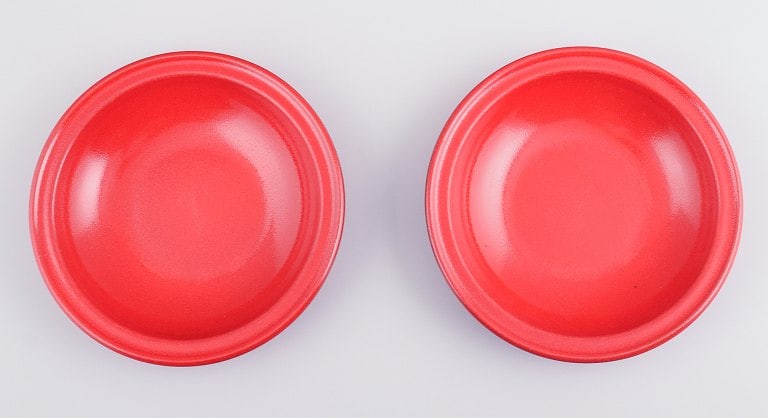 Two French ceramic deep plates with red glaze. Late 1900s.: Title: Two French ceramic deep plates with red glaze. Late 1900s. Description: Two French ceramic deep plates with red glaze. Late 1900s. Measuring: D 21.5 cm. x H 4.0 cm. In perfect condition. Stampe