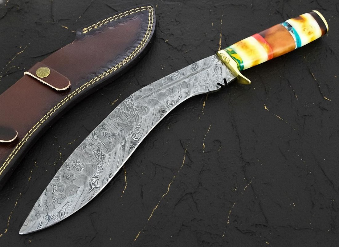 Hand Forged 16.25" Damascus Steel Kukri Knife, Camel Bone Handle, Leather Sheath: Title:Hand Forged 16.25" Damascus Steel Kukri Knife, Camel Bone Handle, Leather Sheath Description:Discover this masterfully crafted, hand-forged Kukri knife, designed for both collectors and outdoor