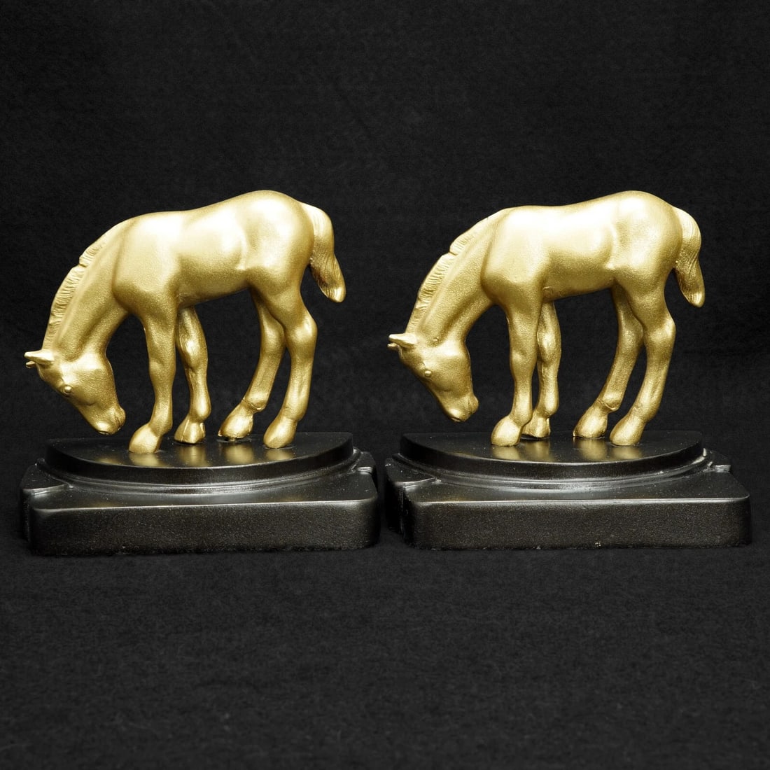Pair Art Deco Grazing Pony Bookends c 1930: Title:Pair Art Deco Grazing Pony Bookends c 1930 Size:5 in (12.7 cm) long x 3 in (7.6 cm) deep x 4 7/8 in (12.4 cm) tall. Description:A golden pair of very Art Deco bookends that will light up a dark