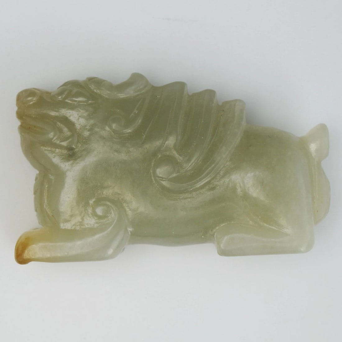 Chinese Bixie Jade Ornament Qing/Republic: Title:Chinese Bixie Jade Ornament Qing/RepublicSize:1 ¾ in (4.4cm) long x ½ in (1.3 cm) wide x 1 in (2.5 cm) tall.Description:An old Chinese jade of a mythical Bixie figure with